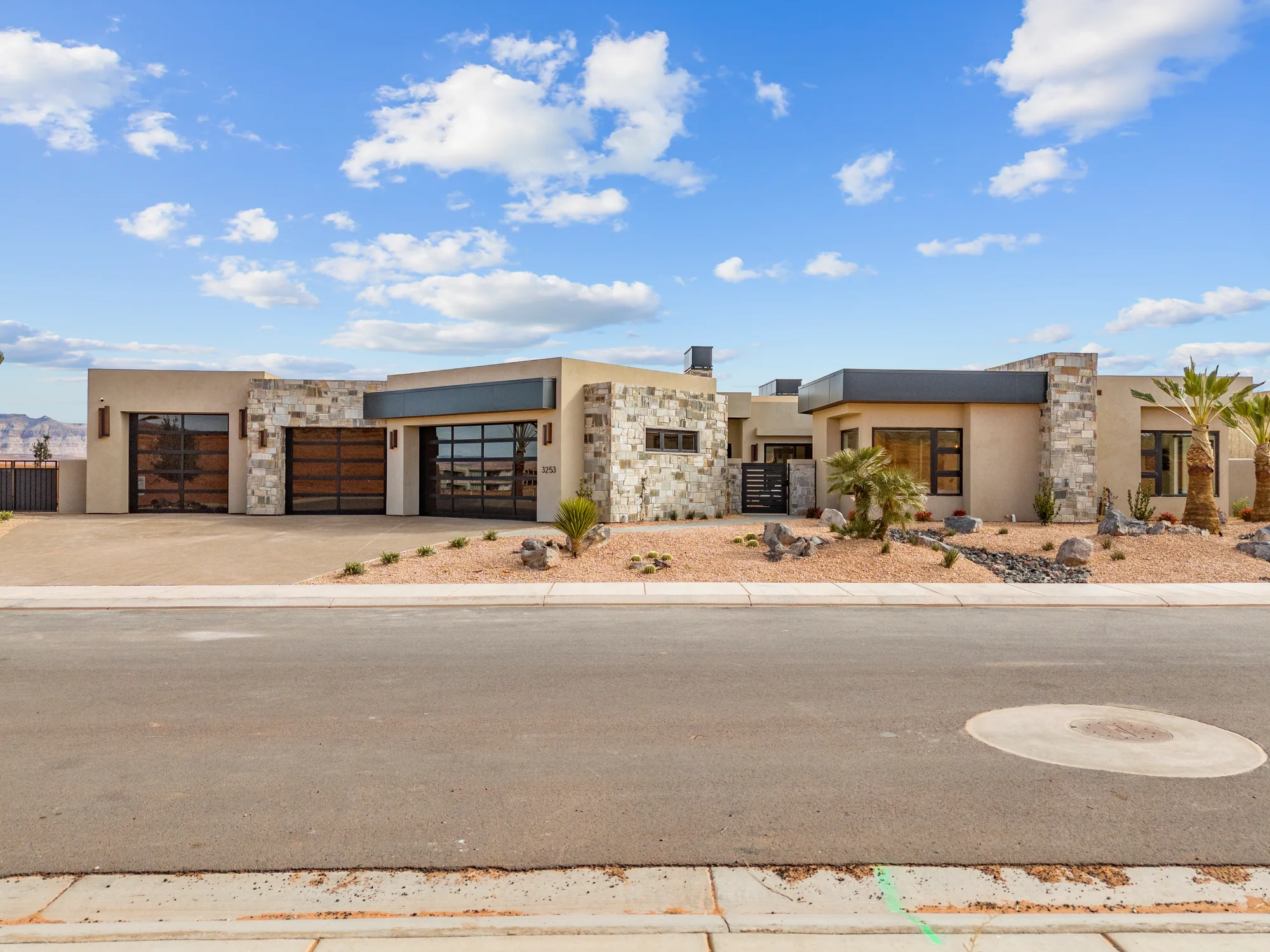 Desert Contemporary custom home surrounded by the red-rock landscape of St. George, Utah