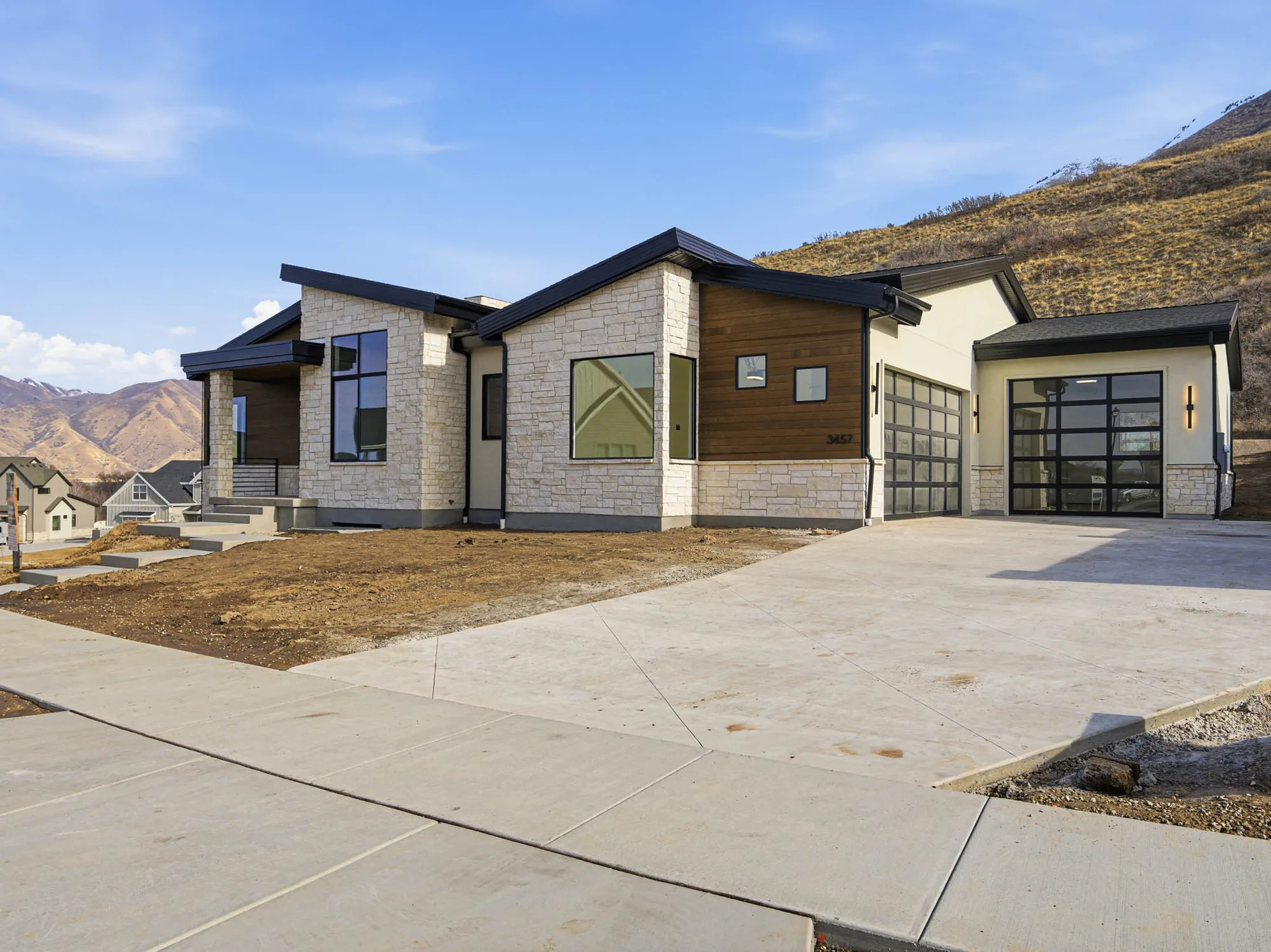Mountain contemporary custom home with stone and warm wood on the Wasatch Front